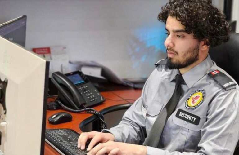 A young security boy is monitoring the security