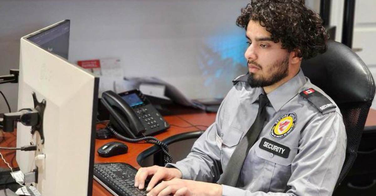 A young security boy is monitoring the security